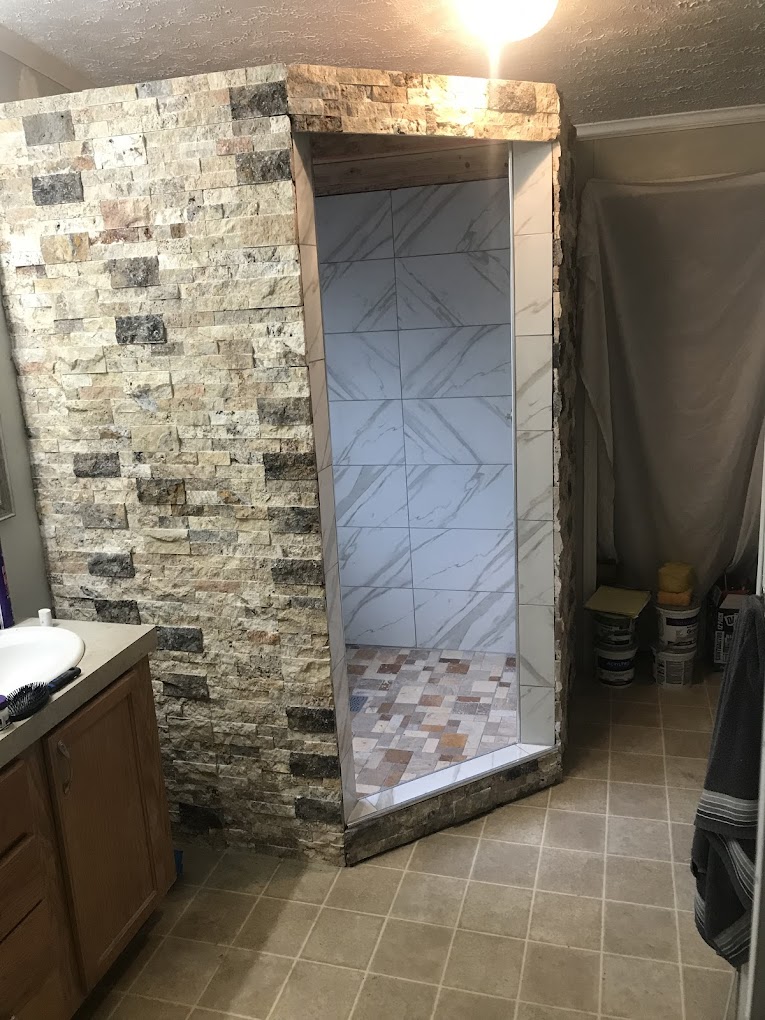 Walk-in tile shower.